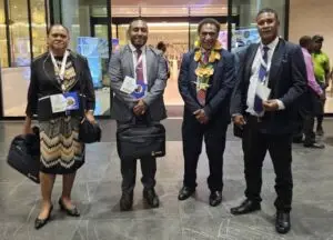 LC Team standing together with Justice Minister
